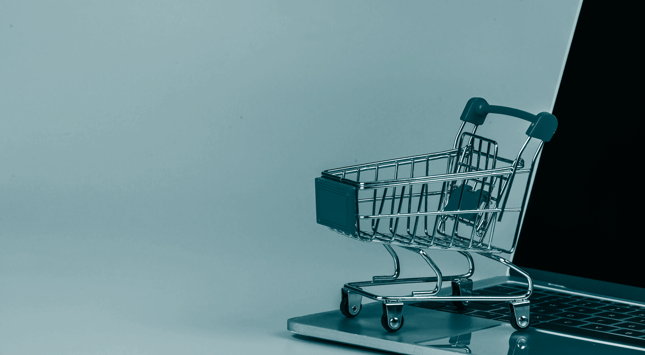 online-shopping-shopping-cart-placed-alongside-notebook-blue